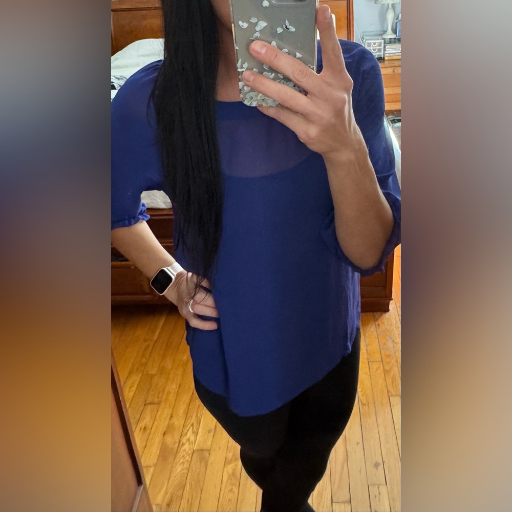 Sheer blue blouse.